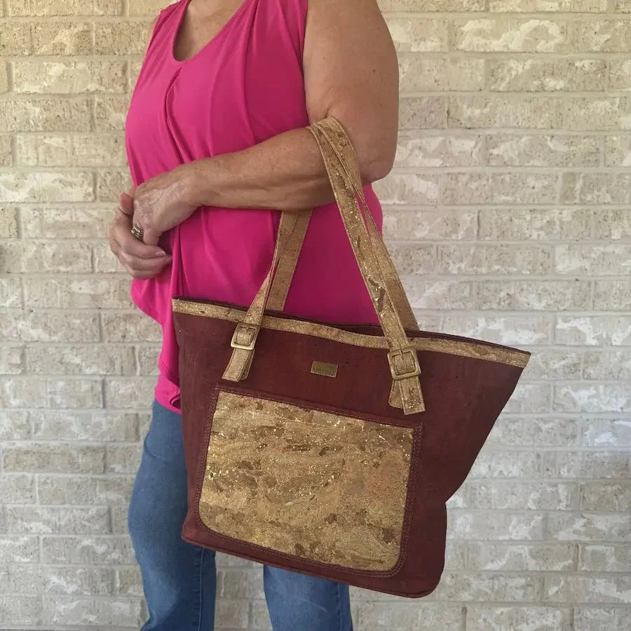 Woman carrying large cork tote.