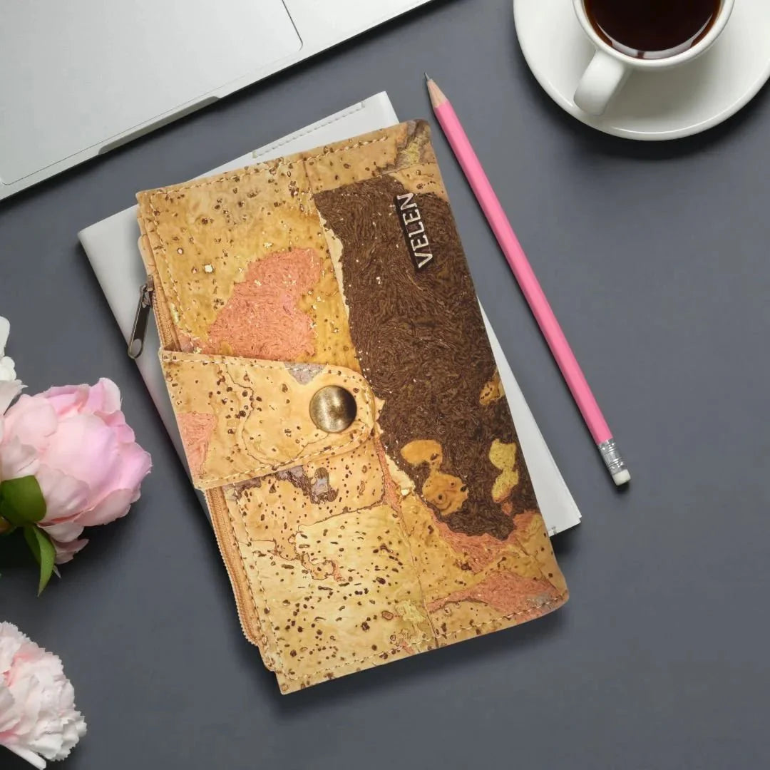 Sierra Snap Wallet on table with pencil and cup of coffee.