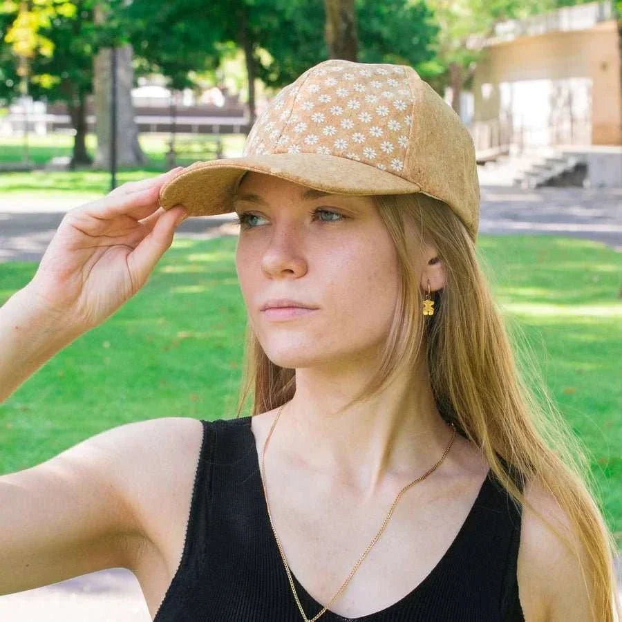 Woman wearing cork baseball cap at child's sporting event