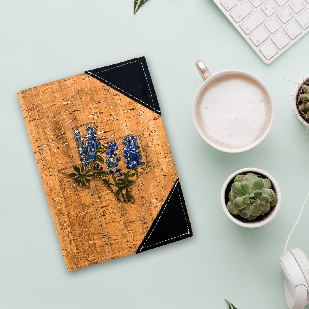 Cork Leather Notebook Cover with hand-painted Texas Bluebonnets on table.
