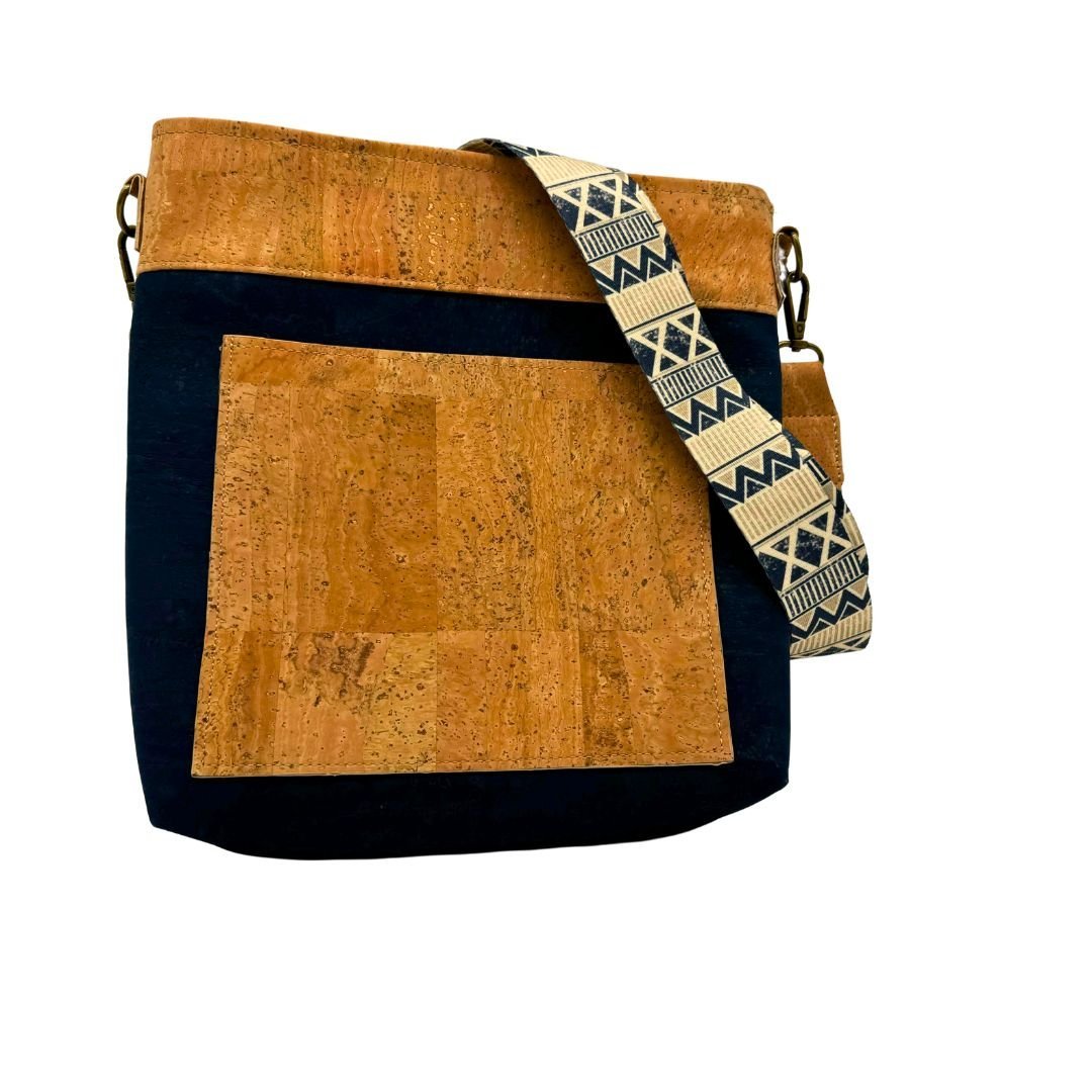 Front of navy and natural cork concealed carry crossbody bag by Texas Cork Company