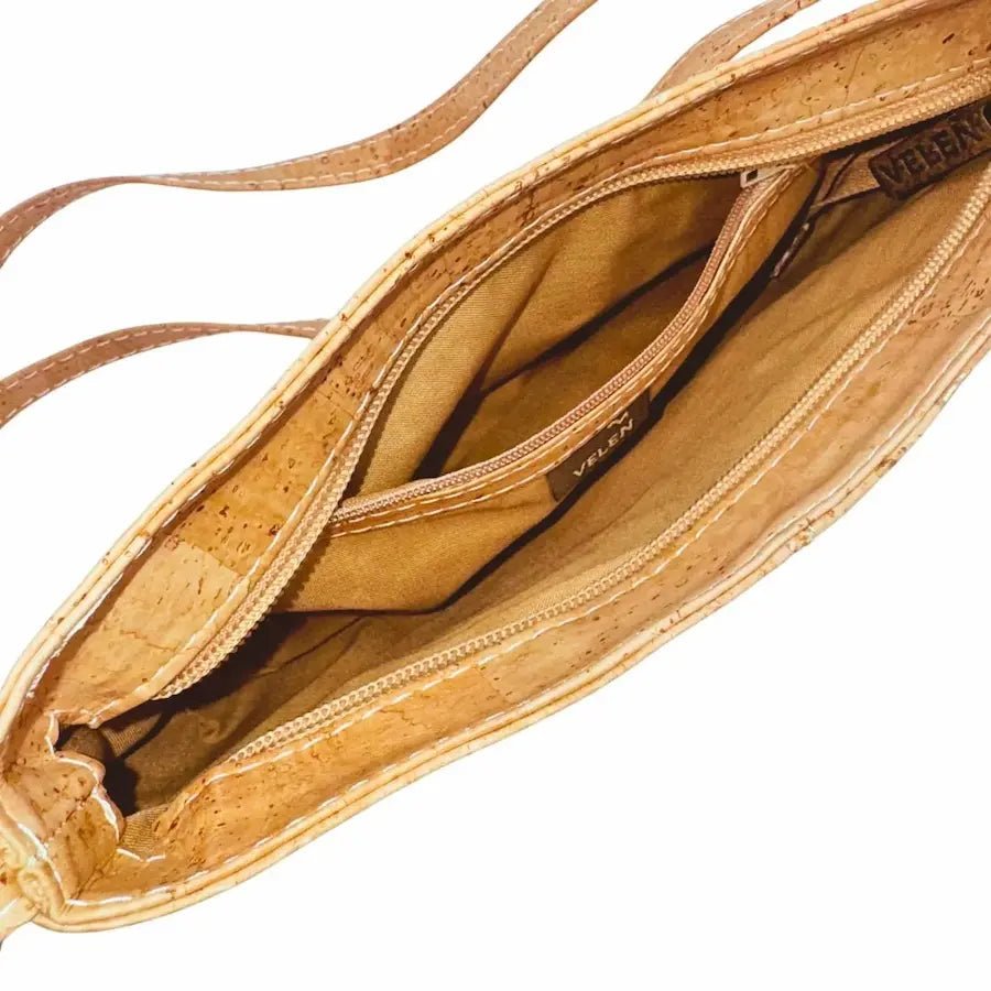 Inside view of Savannah Cork Crossbody Baguette showing zip pocket and main compartment with zip top