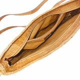 Inside view of Savannah Cork Crossbody Baguette showing zip pocket and main compartment with zip top
