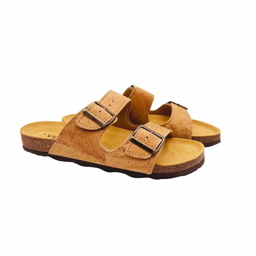 Pair of tan tow strap sandals with double straps on a white background - side view