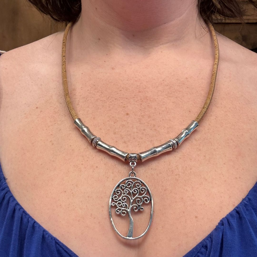 Woman wearing cork necklace with Tree of Life pendant.
