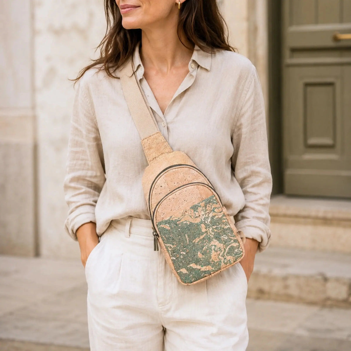 Woman wearing the Albany Cork Sling Bag
