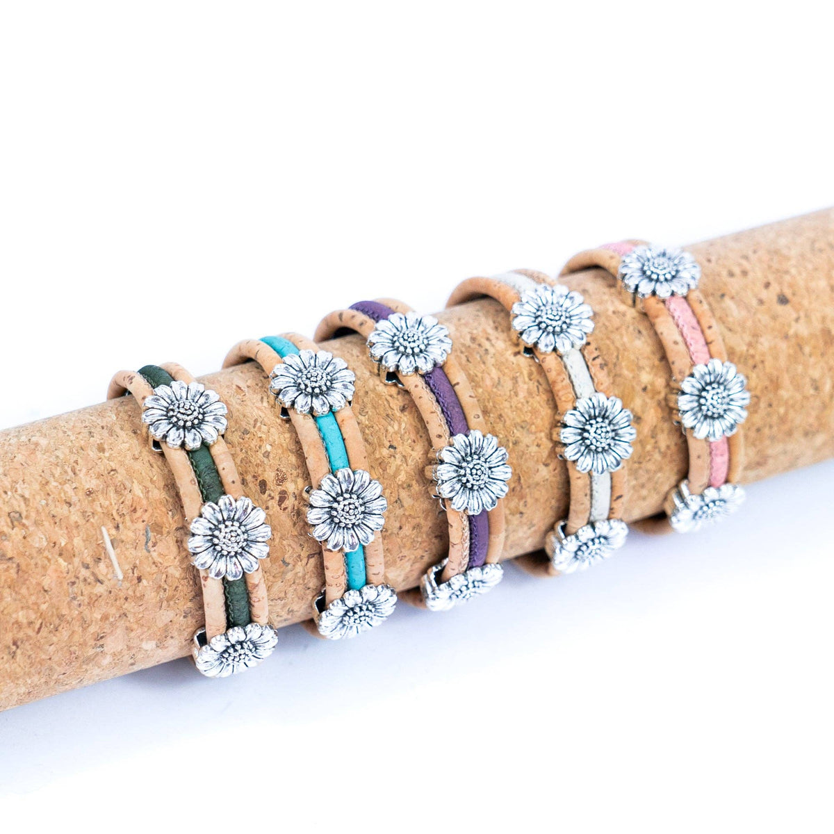 Display of all variations of cork bracelet with chrysanthemum accents from Texas Cork Company