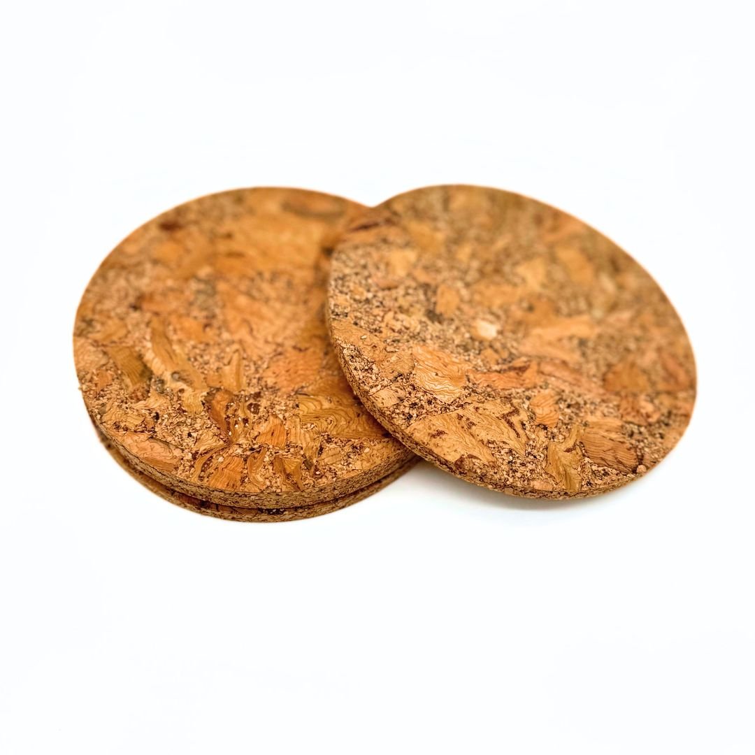 Stack of chunky cork coasters with top one offset by Texas Cork Company