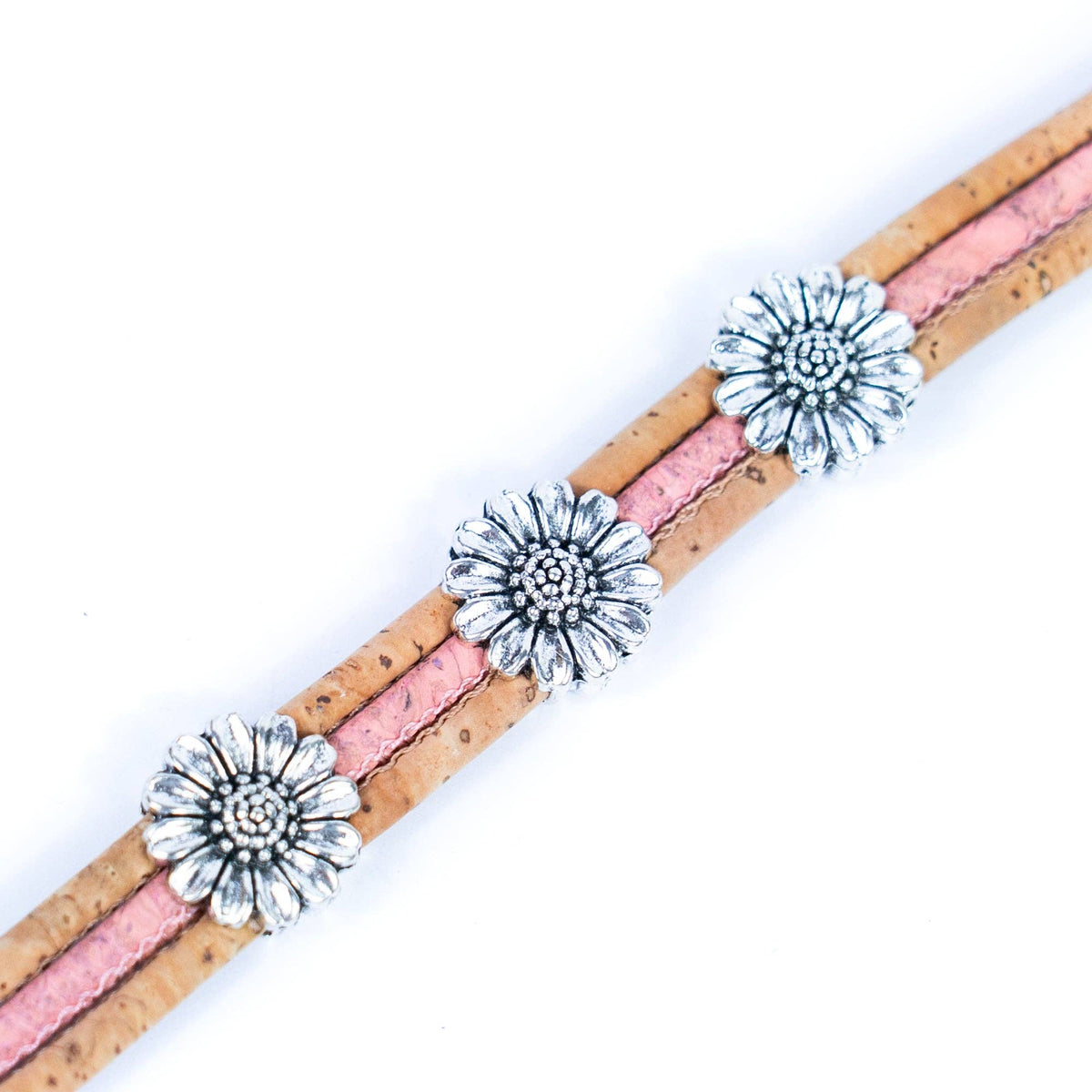 Close up of cork bracelet with chrysanthemum accents from Texas Cork Company