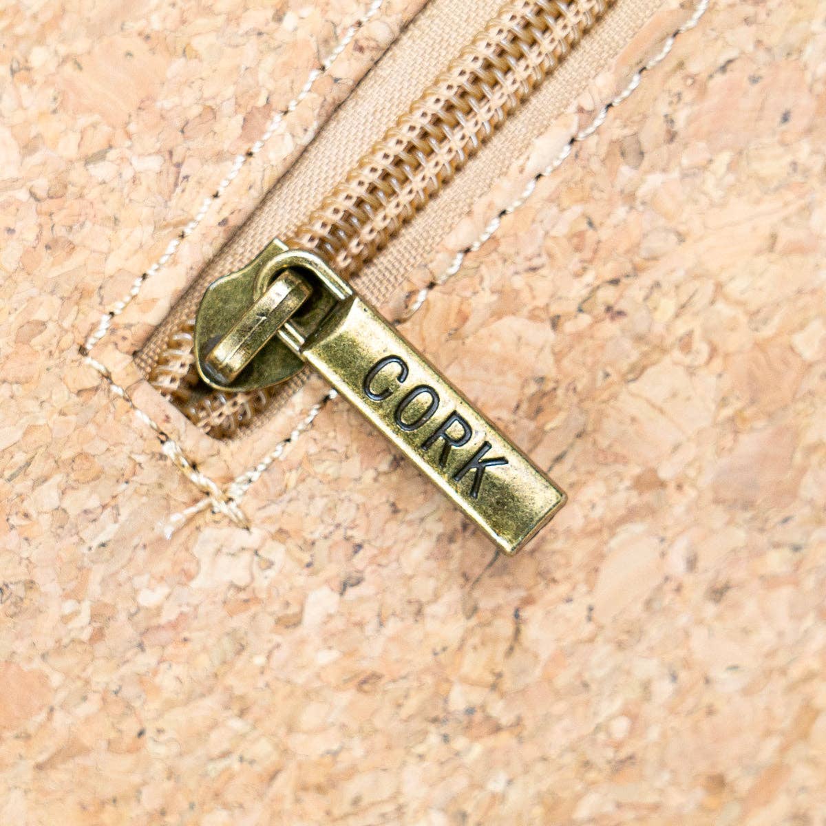 Close-up of zipper pull on Natural Cork Women’s Crossbody Bag from Texas Cork Company