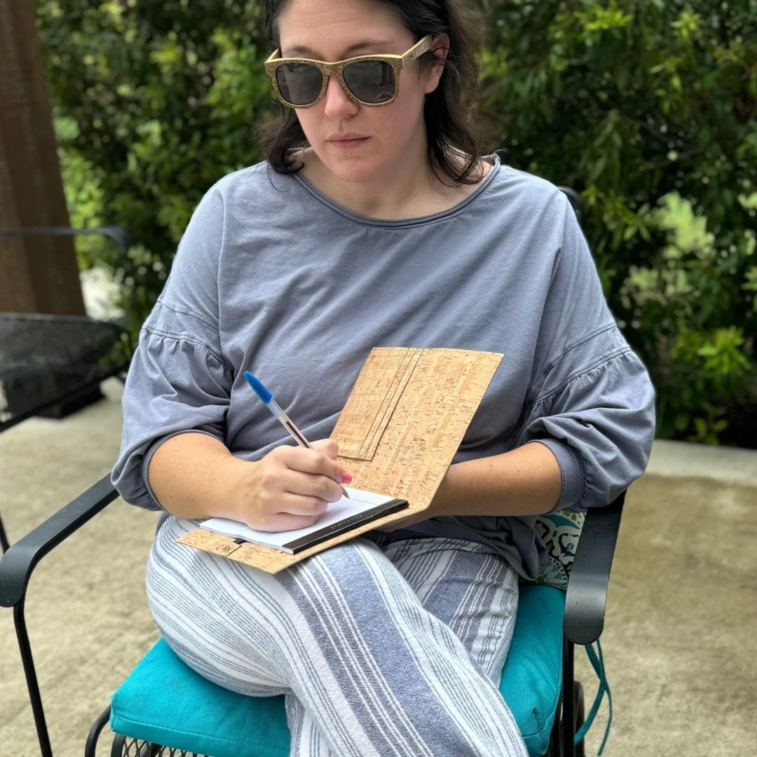 Woman using a Cork Leather Notepad Cover by Texas Cork Company