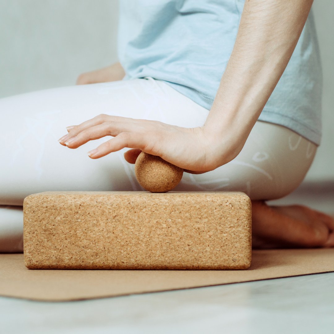 Woman using massage ball to massage her hand