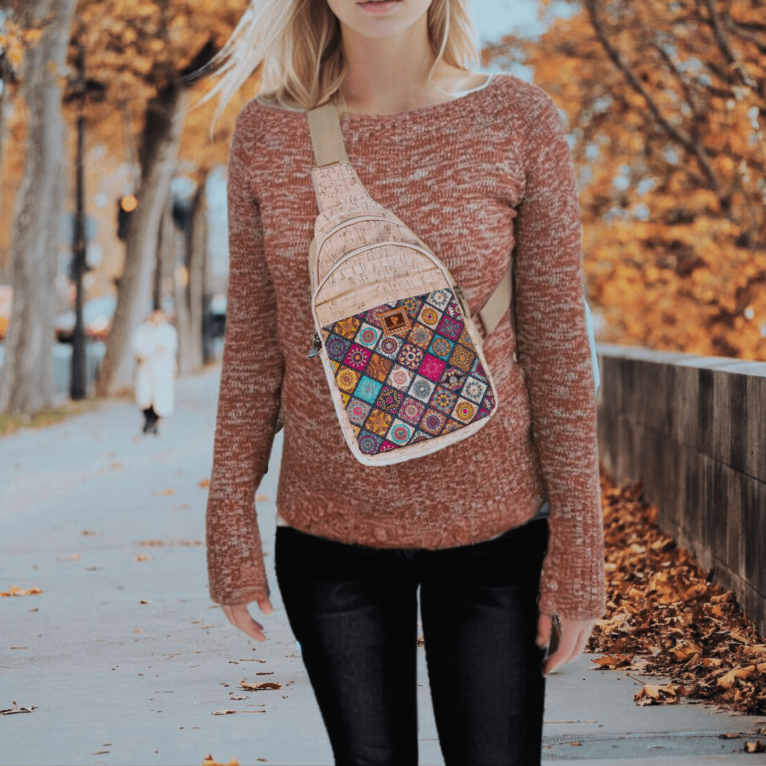 Woman wearing printed rustic cork chest sling bag from Texas Cork Company