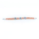 Cork bracelet with chrysanthemum accents layed out flat from Texas Cork Company
