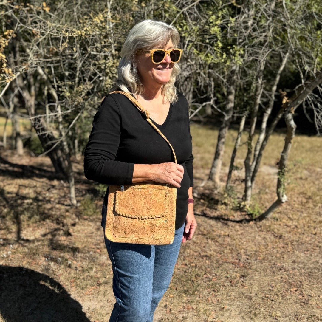 Woman wearing Natural Cork Shoulder Bag with gold metallic accents from Texas Cork Company.