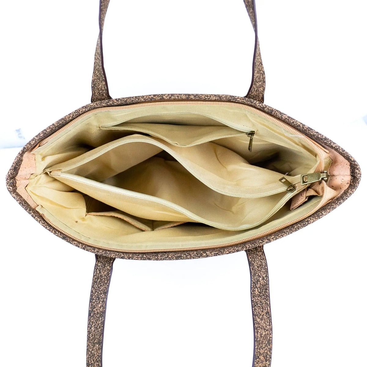 Interior view of Kona Cork Tote Bag showing zippered divider, zippered inside pocket and 2 slip pockets.
