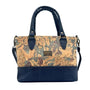 Front of Napa Luxe convertible bag in Blue Chameleon with a navy blue bottom, strap, and handles. 