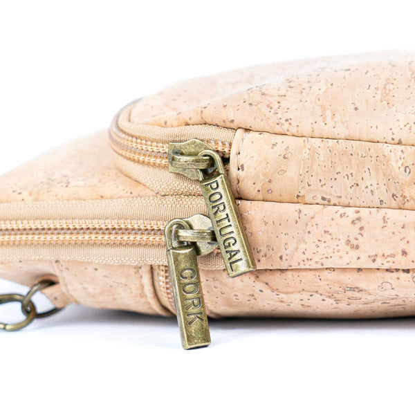Closeup of the zipper pulls of Women's Natural Cork Phone Bag in natural color from Texas Cork Company