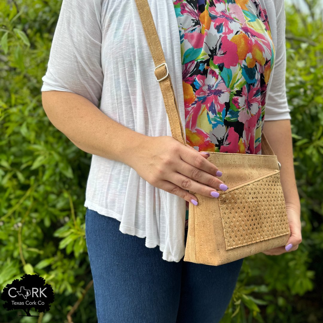 Woman wearing a natural laser-cut cork crossbody bag - Texas Cork Company