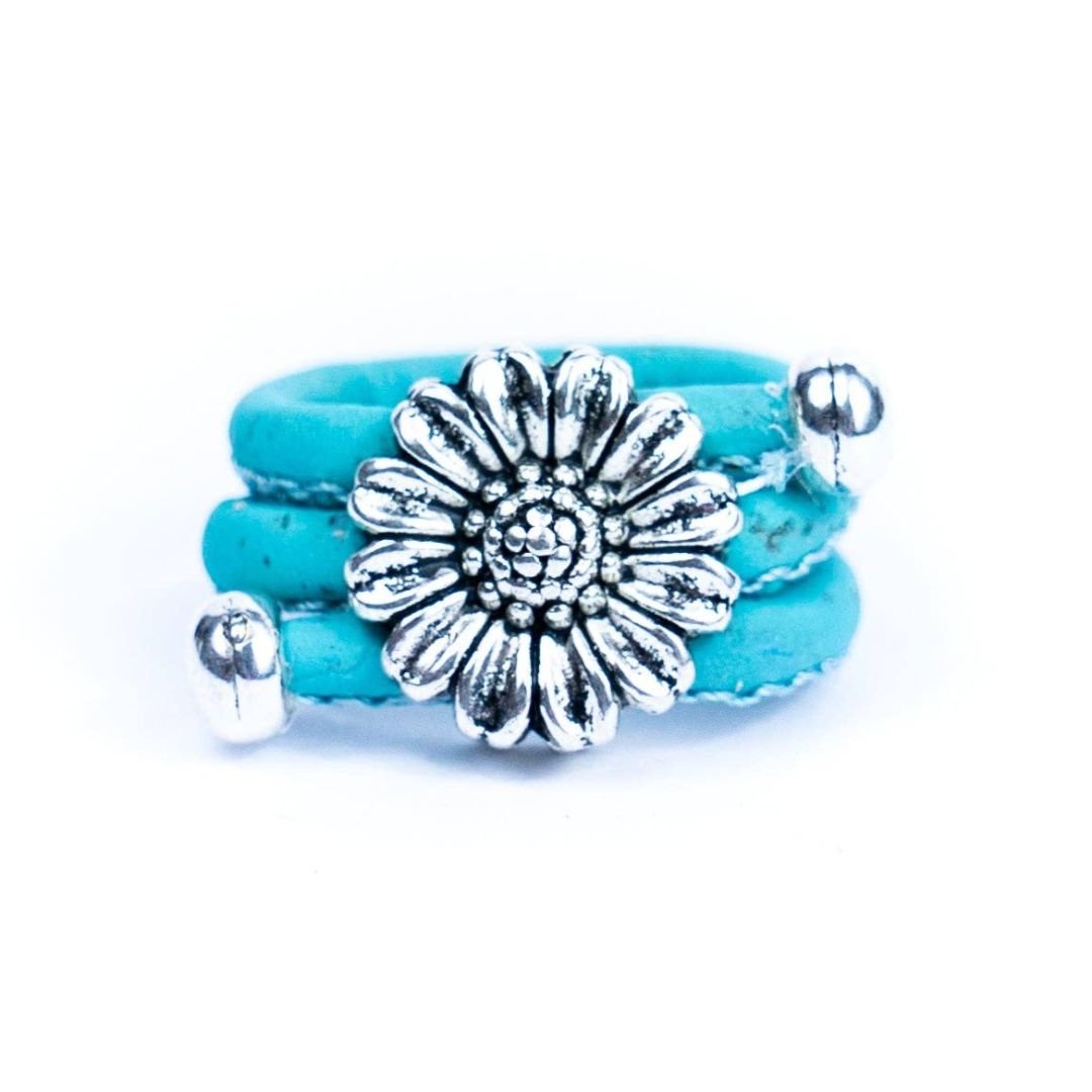 Blue adjustable cork ring with chrysanthemum pendant from Texas Cork Company