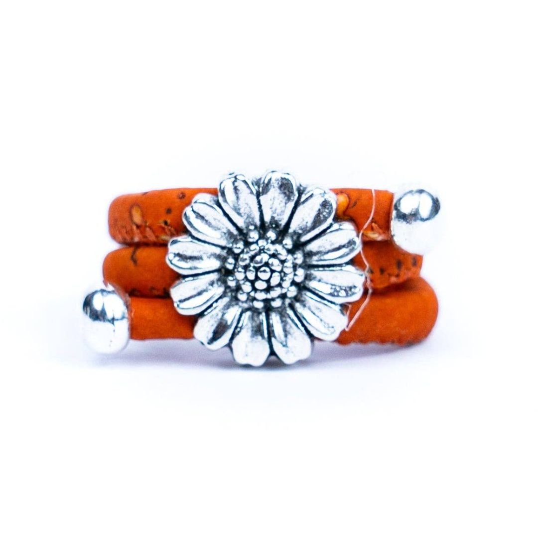 Orange adjustable cork ring with chrysanthemum pendant from Texas Cork Company