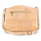 Arlington cork crossbody bag back view in a natural light tan cork texture with a zippered pocket and a gold-tone buckle, shown on a white background.