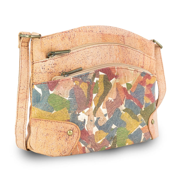 Arlington crossbody handbag made of natural cork with a colorful abstract patterned metal zippers and hardware, shown on a white background.