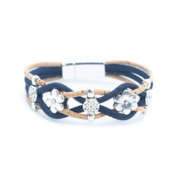 A multi-strand wrap bracelet featuring navy blue and tan cork cords, silver-tone floral charms, and a silver-tone magnetic clasp, shown on a plain white background.