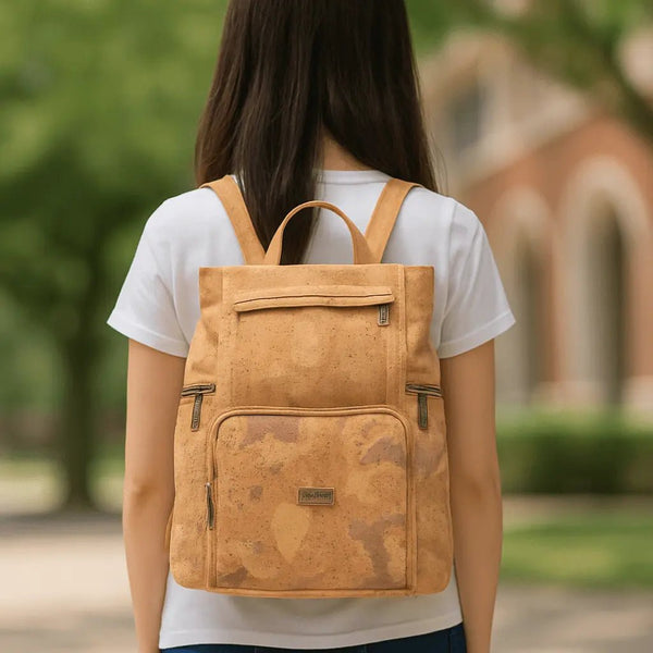 Student wearing the Akron Cork Backpack on campus.