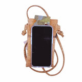 Cork cell phone case with phone on top to demonstrate size