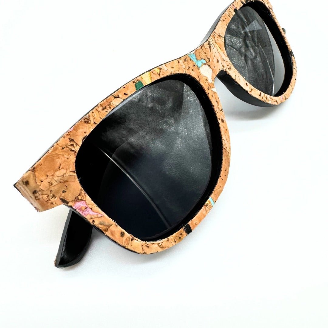 Closeup of stained cork and bamboo sunglasses with black lenses and confetti cork by Texas Cork Company.