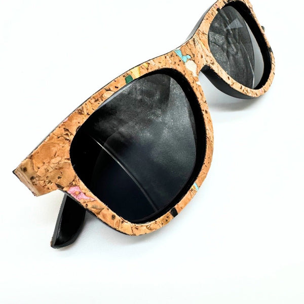 Closeup of stained cork and bamboo sunglasses with black lenses and confetti cork by Texas Cork Company.