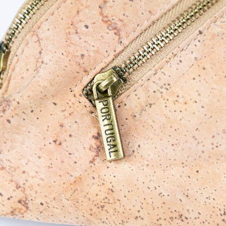 Closeup of zipper and cork of cork sling bag fanny pack from Texas Cork Company