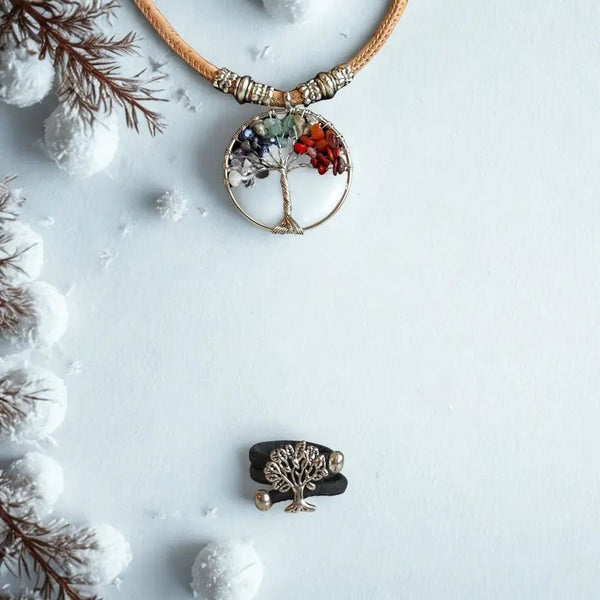 Necklace with a tree of life pendant on a snowy background with black cork ring
