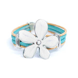 Front of light blue cork bracelet with flower pendant