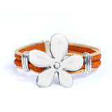 Front of orange cork bracelet with flower pendant