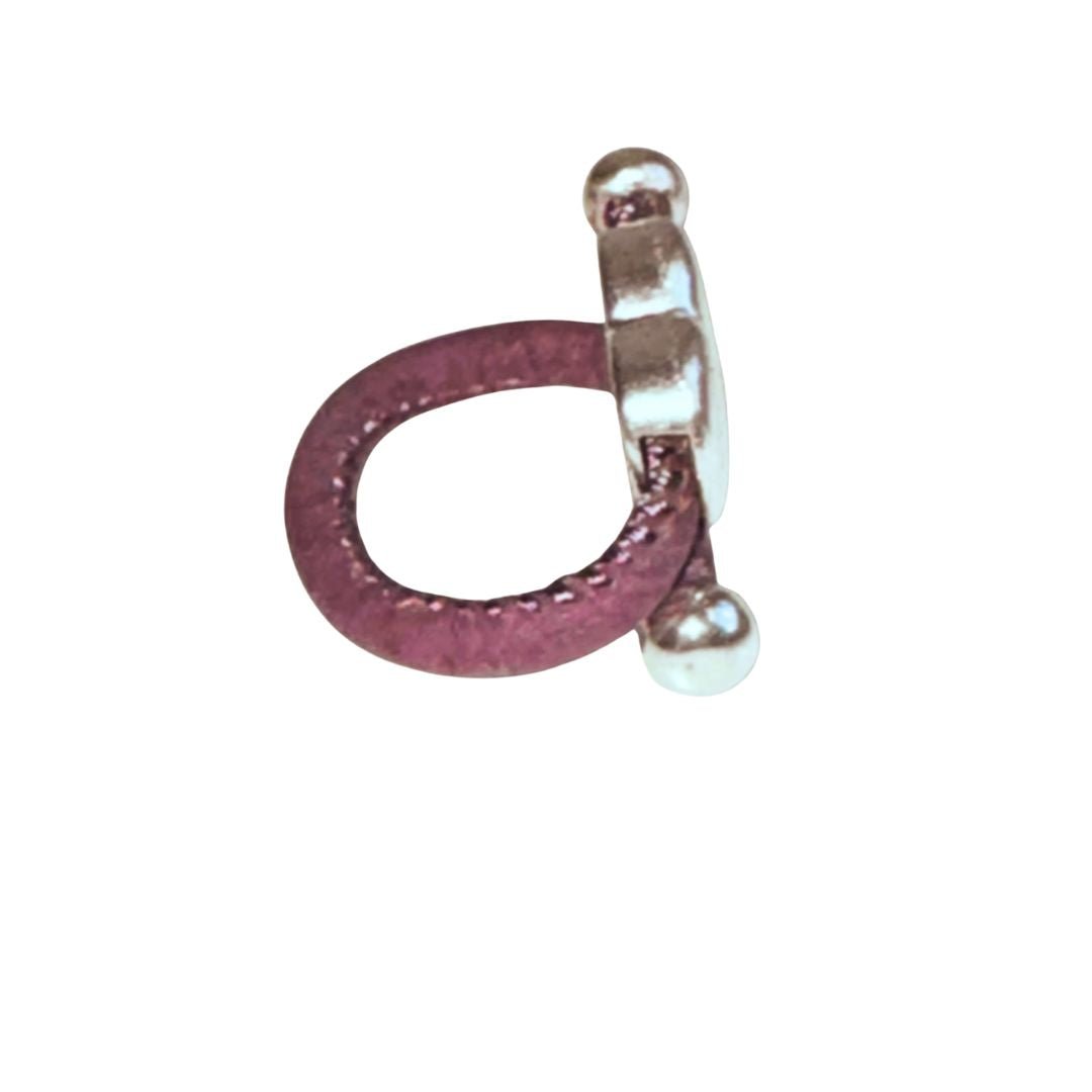 Silver heart charm purple cork ring side view on a white background