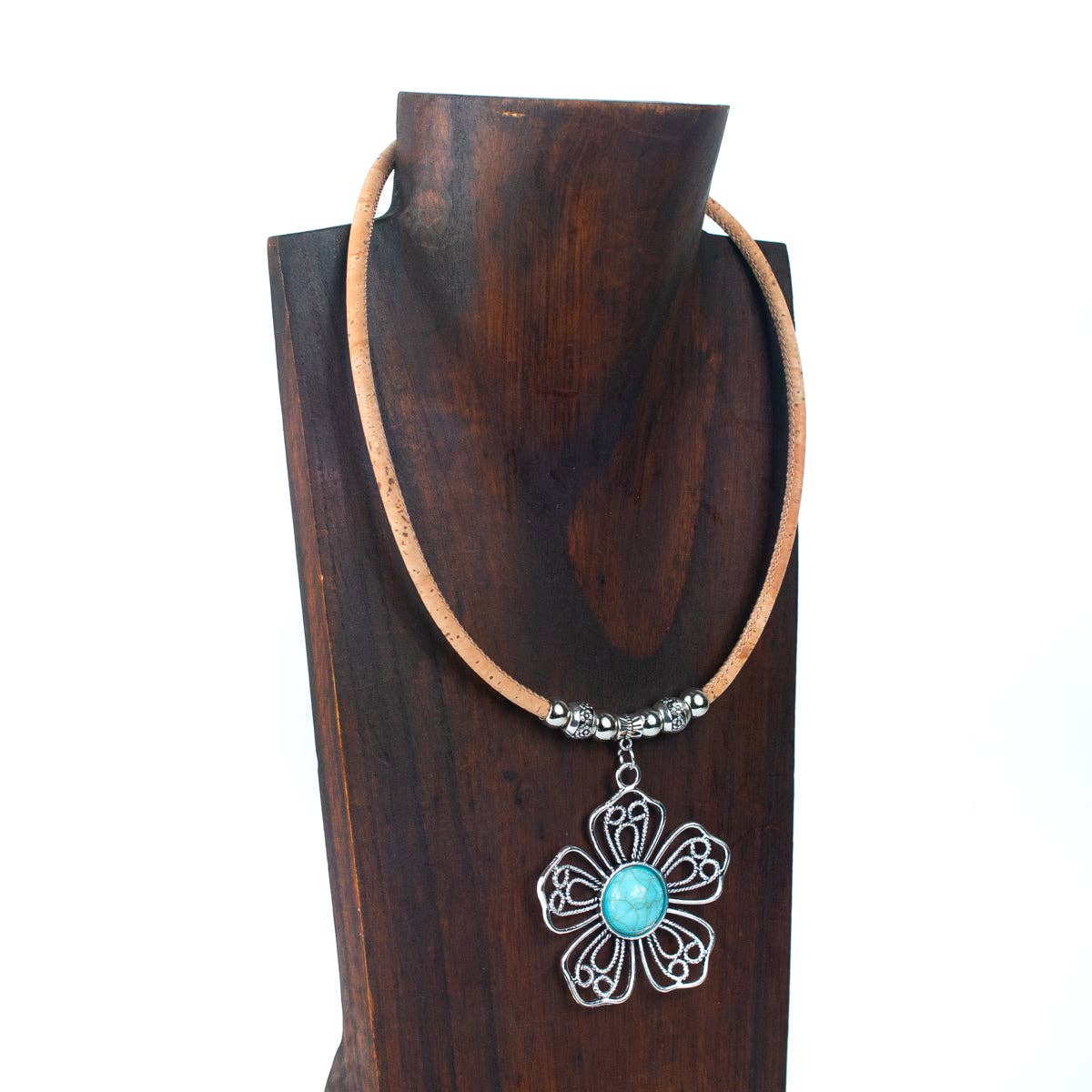 Natural cork cord with turquoise ceramic and zamak flower from Texas Cork Company on a neck display