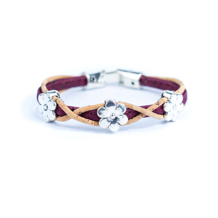 Bracelet with burgundy and natural cork design and silver daisy charms on a white background