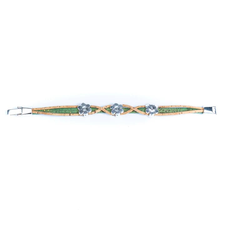Bracelet with twist design and daisy charms on a white background