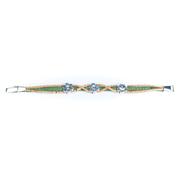 Bracelet with twist design and daisy charms on a white background