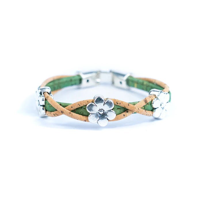 Bracelet with green and natural cork design and silver daisy charms on a white background