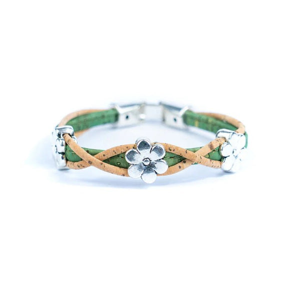 Bracelet with green and natural cork design and silver daisy charms on a white background