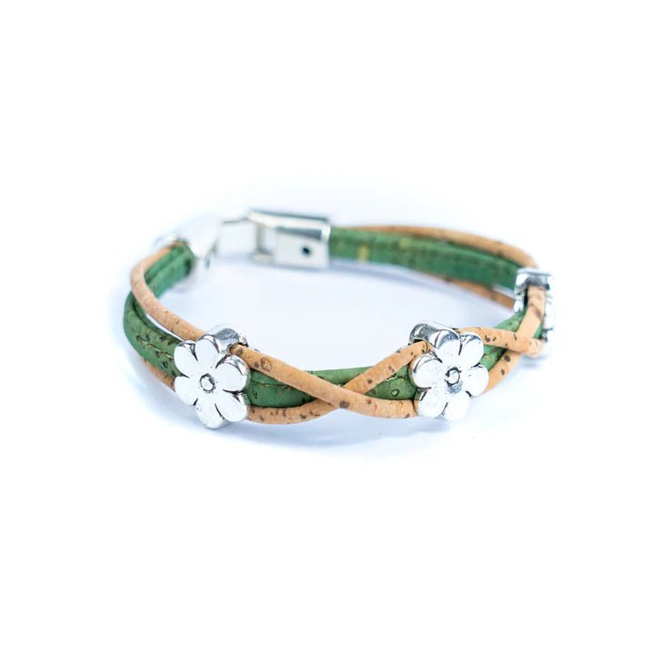 Green cork bracelet side with silver daisy charms on a white background