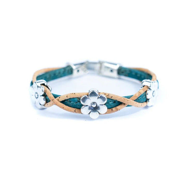 Bracelet with teal and natural cork design and silver daisy charms on a white background