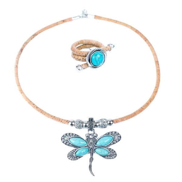 Necklace with turquoise dragonfly pendant and cork ring on a white background