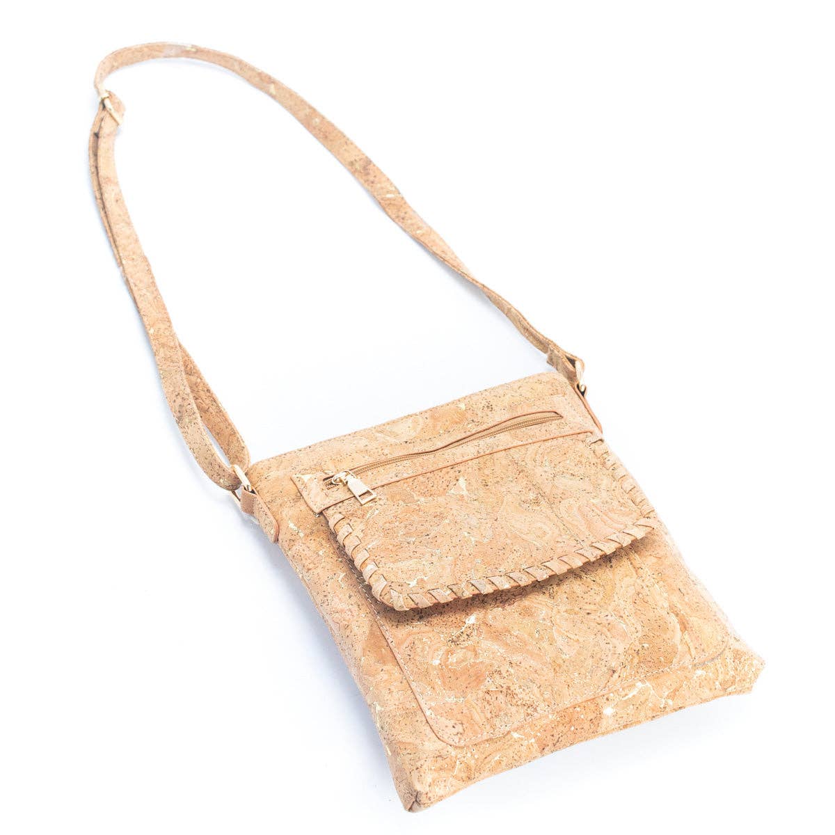 Extended strap of molten gold cork shoulder bag with metallic accents from Texas Cork Company