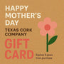Mother's Day Gift Card with pink flower on cork background