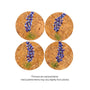 Four round cork coasters with hand painted bluebonnet design on a white background