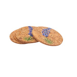 Set of four cork coasters with hand painted bluebonnet design on a white background
